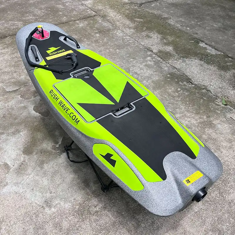 Green electric surfboard deck view