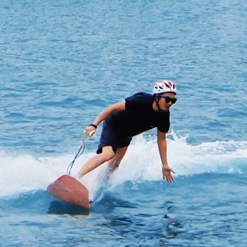 Man riding electric power surfboard