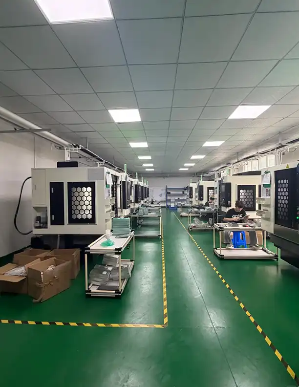 CNC machining center workshop — machine depreciation and skilled-operator time are fixed costs that set a genuine price floor
