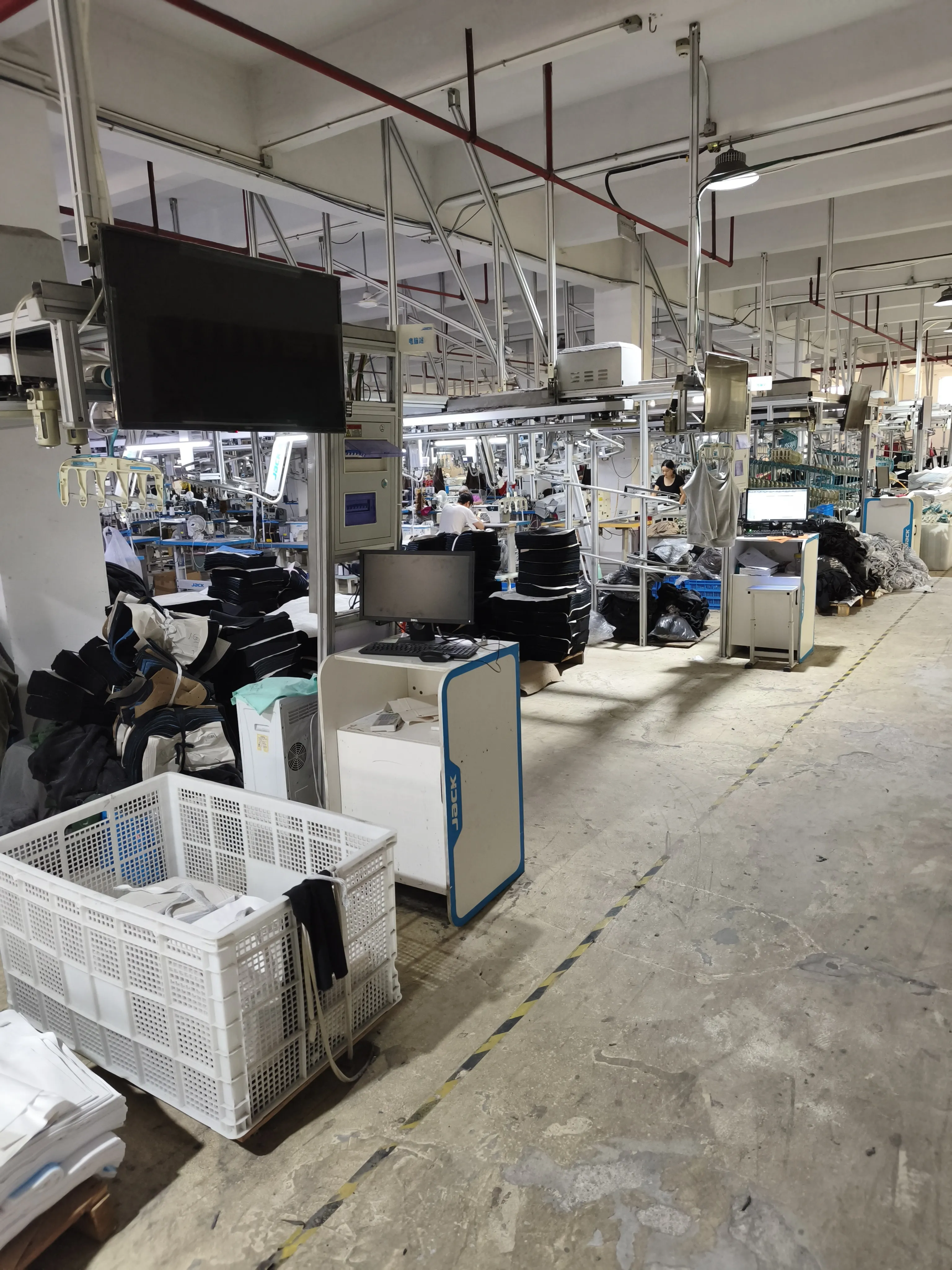 Production activity inside a one-roof garment manufacturing facility in China