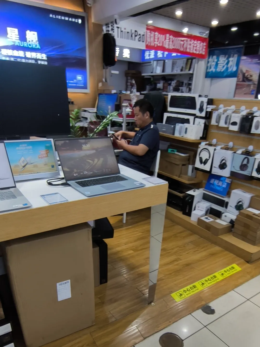 Stack of laptop accessories and replacement parts on a SEG lower floor counter